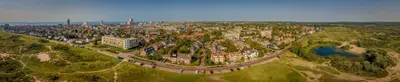an aerial view of a city with buildings and trees at Hotel / Pension Villa Tanahlot in Zandvoort