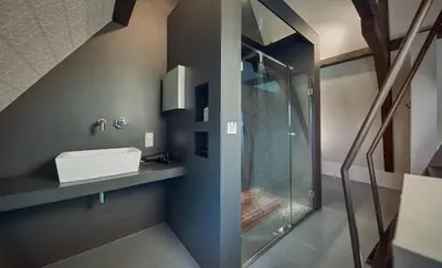 a bathroom with a sink and a glass shower at HUISJES AAN DE AMSTEL - Your home away from home in Amstelveen