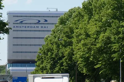 a building with an american rail sign in front of a tree at Xaviera's Bed and Breakfast in Amsterdam