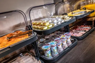a buffet with many different types of food and drinks at Hotel Atlantis Amsterdam in Amsterdam