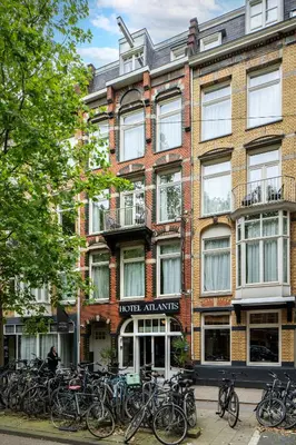 a building with bikes parked in front of it at Hotel Atlantis Amsterdam in Amsterdam