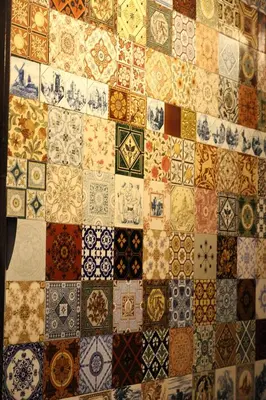 a wall with a bunch of different types of tiles at Bed & Breakfast The 9 Streets in Amsterdam