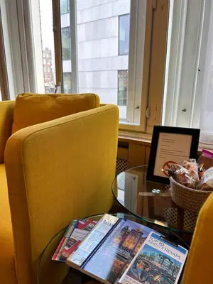 a table with a chair and a laptop on a table at Amsterdam 4 Holiday GuestRooms in Amsterdam