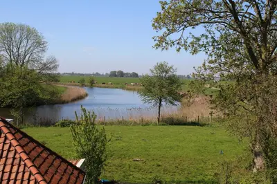 a view of a river from a house at FortEdam in Edam