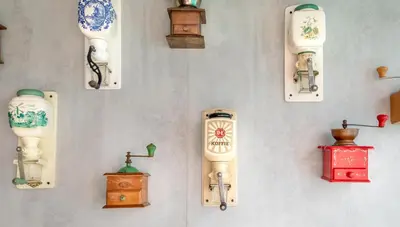 a wall with many different types of old clocks at Hotel Espresso in Amsterdam