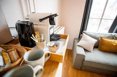 a living room with a couch and a coffee table at Bambu Sleep Boutique in Haarlem