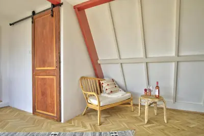 a room with a chair and a table at Rooftop studio near Amsterdam Castle (Muiden) in Muiden