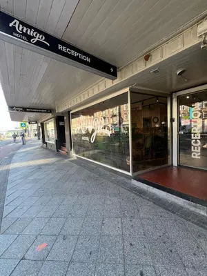 a store front of a building with a sign on it at Amigo Budget Hotel in Amsterdam