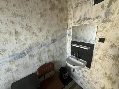 a bathroom with a sink and a mirror at Amigo Budget Hotel in Amsterdam