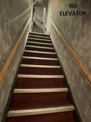 an escalator with a sign that says no elevator at Amigo Budget Hotel in Amsterdam