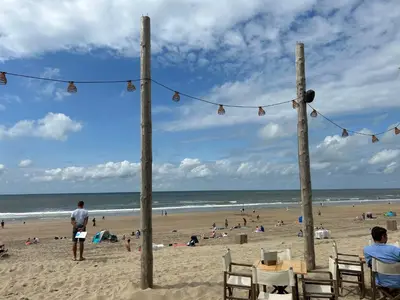 a group of people on a beach with people at Holiday Home Plevier Comfort-3 by Interhome in Noordwijkerhout