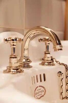 a bathroom sink with a silver faucet at Logement Swaenenvecht in Utrecht