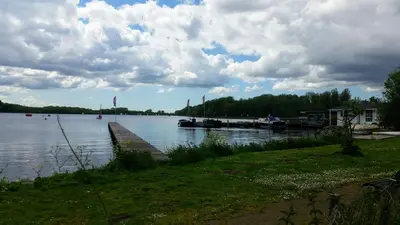 a view of a lake with a dock on the water at Motorjacht Flint in Amsterdam