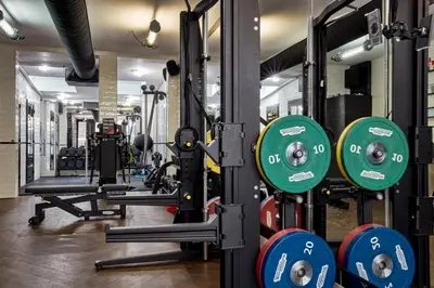 a gym with dumbbells and other equipment at Sir Albert Hotel, part of Sircle Collection in Amsterdam