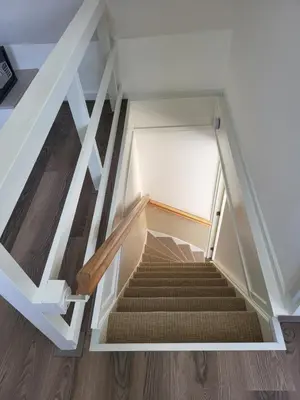 a staircase in a house with a stair case at FlipFlop in Noordwijk aan Zee