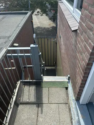 a stairway leading up to a building with a window at Apartment at the Beach in Noordwijk aan Zee