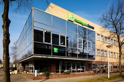 a building with a sign on the front of it at Holiday Inn Express Amsterdam - South by IHG in Amsterdam