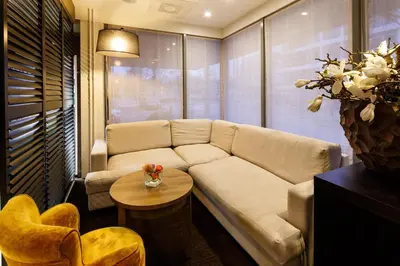 a living room with a couch and a table at Holiday Inn Express Amsterdam - South by IHG in Amsterdam