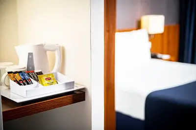 a hotel room with a table with a box of products at Holiday Inn Express Amsterdam - South by IHG in Amsterdam