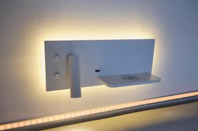 a lightswitch on a wall in a room at Treehouse Inn in Duivendrecht