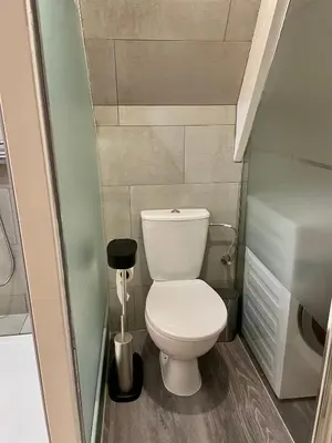 a small bathroom with a toilet in a small room at Olive Bed and Breakfast in Amsterdam