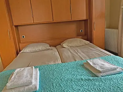 a bed with two towels on top of it at Villa Prinsenhof # Eén in Bergen