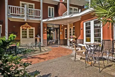 a patio with a table and chairs in front of a building at Villa Prinsenhof # Eén in Bergen