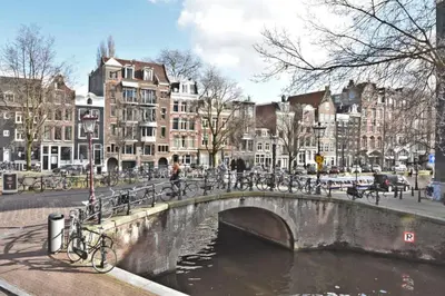 a bridge over a river in a city with buildings at Villa Prinsenhof # Eén in Bergen