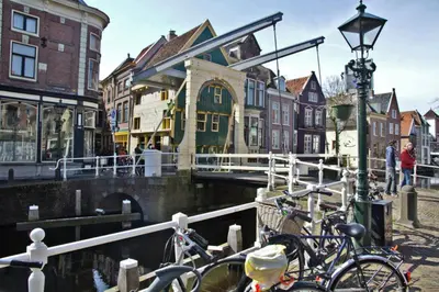 a group of bikes parked next to a canal at Villa Prinsenhof # Eén in Bergen