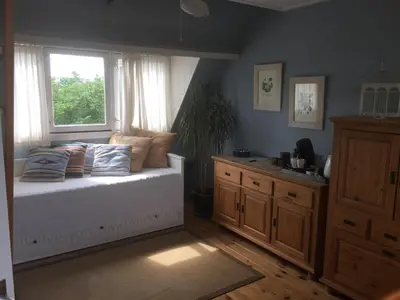a bedroom with a bed and a window at Blaine's: A B&B and private dining.... in Amsterdam