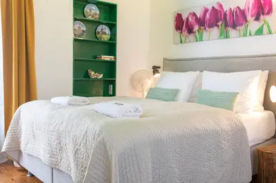 a bedroom with a bed with two towels on it at Tulip of Amsterdam in Amsterdam