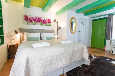 a bedroom with a bed with two towels on it at Tulip of Amsterdam in Amsterdam
