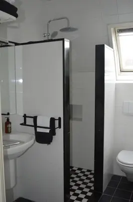a bathroom with a sink and a toilet at Bed & Breakfast Jo Amsterdam in Amsterdam