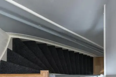 a stair case with black stairs in a house at Westerpark Suites in Amsterdam