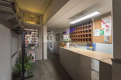 a kitchen with a long counter in a store at Hotel Faber in Zandvoort