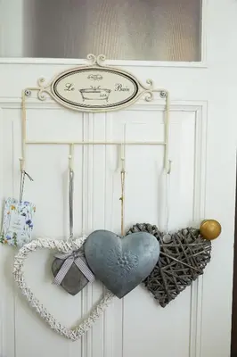a pair of hearts are hanging on a door at Guest House Aquarius in Zandvoort