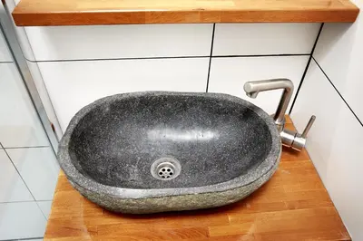 a black sink on a counter in a bathroom at Guest House Aquarius in Zandvoort