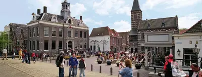 a crowd of people walking around a street in a city at Edam, Garden Room with private entrance and rural view in Edam