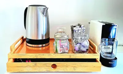 a wooden tray with a coffee maker and other items at Edam, Garden Room with private entrance and rural view in Edam