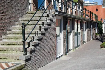 a set of stairs on the side of a brick building at Dorpsplein Appartement in Zandvoort