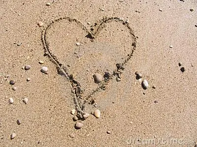 a heart drawn in the sand on the beach at Studio Zandvoort in Zandvoort