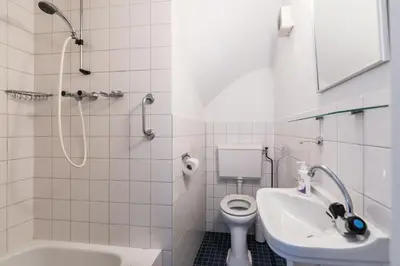 a bathroom with a sink and a toilet and a shower at Anny's Warehouse City Centre! in Amsterdam