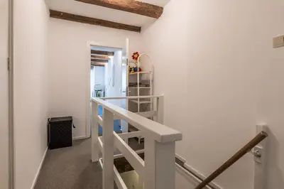 a staircase in a room with a white stair case at Anny's Warehouse City Centre! in Amsterdam