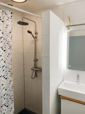 a bathroom with a shower and a sink at ECHT-Bergen in Bergen