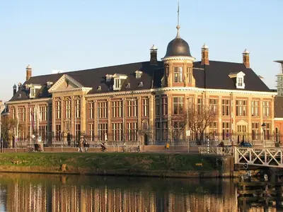 a large building next to a body of water at B&B Muntzicht in Utrecht