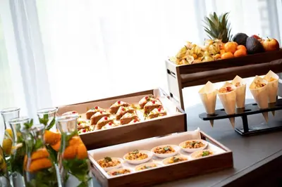 two boxes of food on a table with fruit at Renaissance Amsterdam Schiphol Airport Hotel in Schiphol