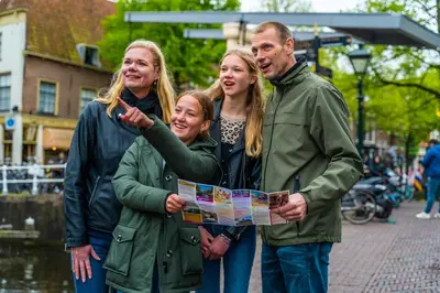 a group of people looking at a map at Europarcs Koningshof in Schoorl