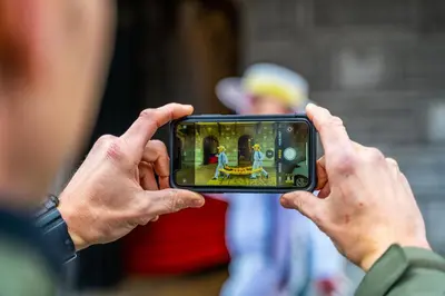a person taking a picture with a camera at Europarcs Koningshof in Schoorl