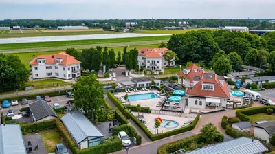 an aerial view of a house with a pool at EuroParcs Noordwijkse Duinen in Noordwijk aan Zee