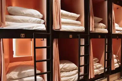 a group of bunk beds in a room with towels at Durty Nelly's Inn in Amsterdam